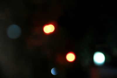 Defocused image of illuminated lights at night