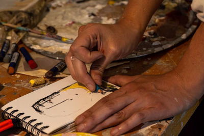 Cropped image of man working at table