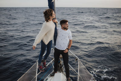 Couple enjoying vacation on boat in sea