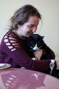 Portrait of woman with cat