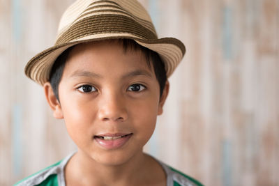 Portrait of cute boy wearing hat