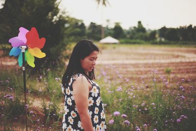 Beautiful woman standing on field