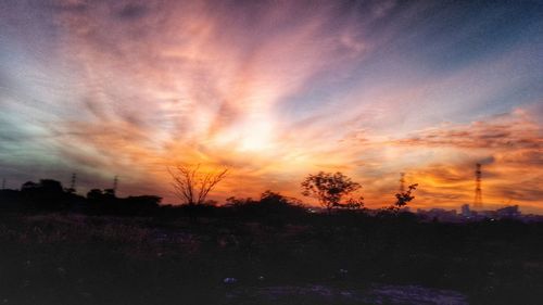 Scenic view of landscape against sky at sunset