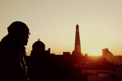 Silhouette of city at sunset