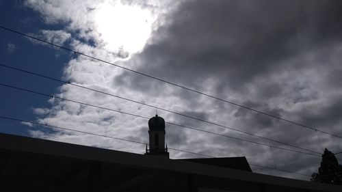Low angle view of silhouette bridge against sky