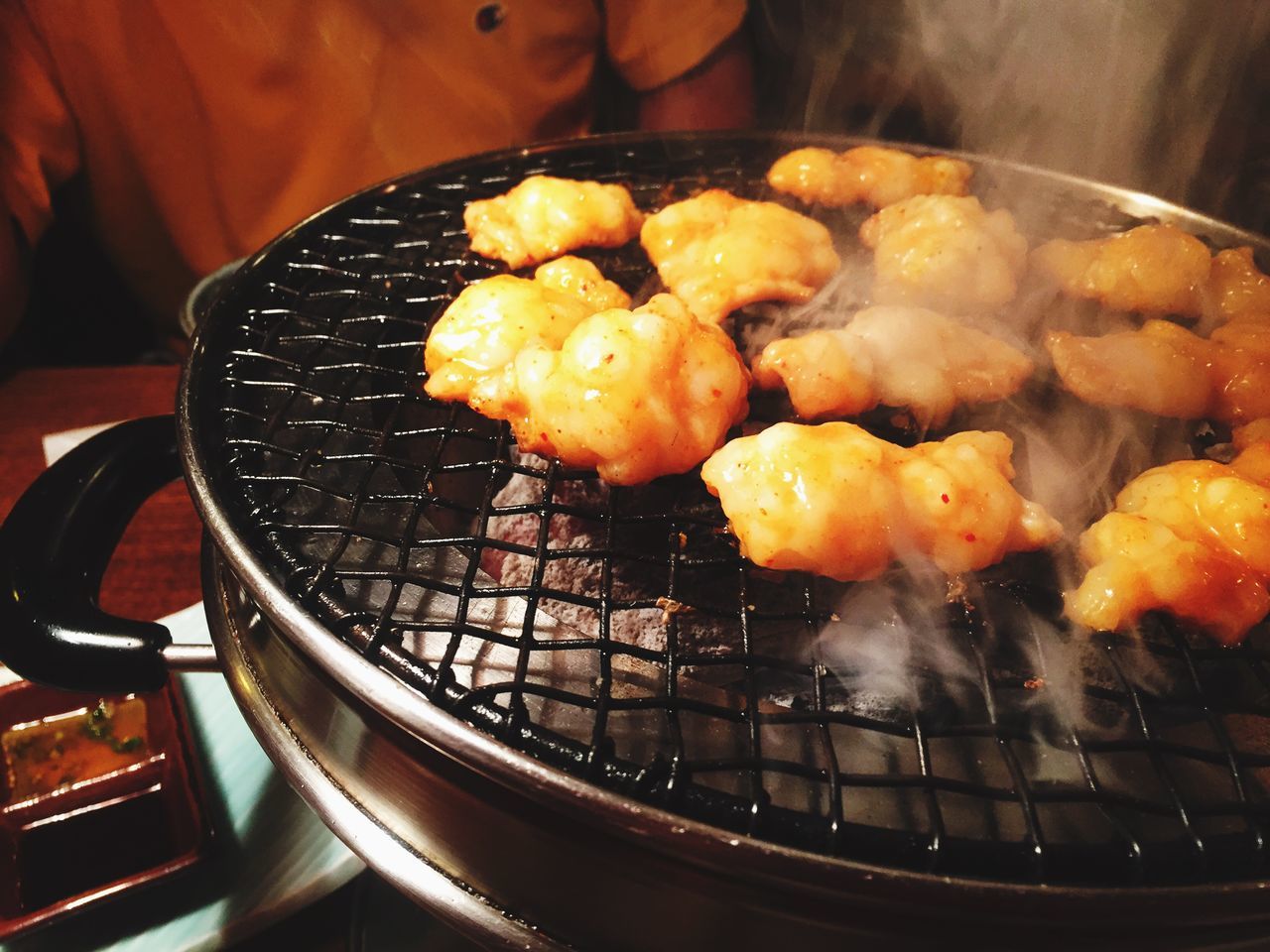 food and drink, food, indoors, freshness, cooking, healthy eating, preparation, preparing food, heat - temperature, still life, close-up, barbecue grill, cooking pan, frying pan, barbecue, meat, bowl, meal, orange color, ready-to-eat