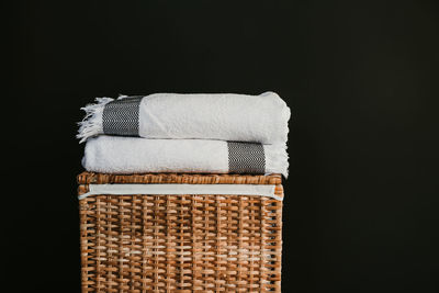Close-up of wicker basket on black background