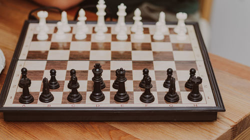 Close-up of chess pieces on table