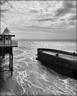 Scenic view of sea against cloudy sky