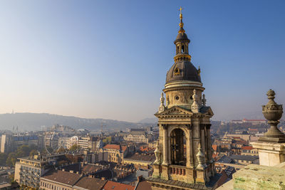 High angle view of buildings in city against clear sky