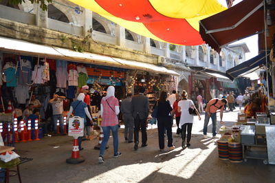 People at market stall