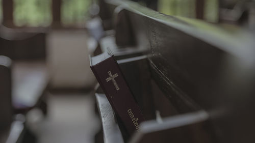Close-up of bible in shelf
