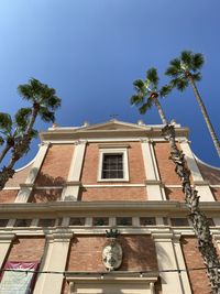 Low angle view of building against blue sky