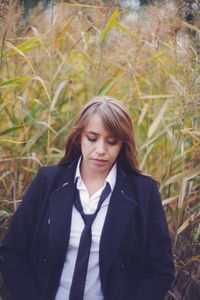 Businesswoman standing in forest