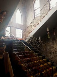 Man standing by staircase in building