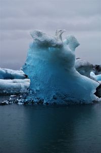 Frozen lake against sky