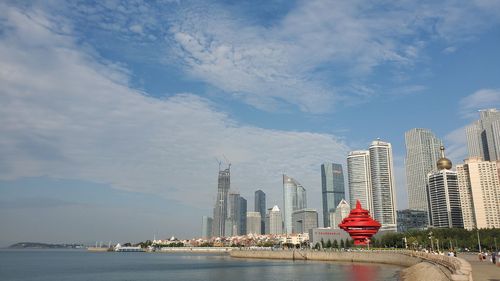 Modern buildings in city against sky