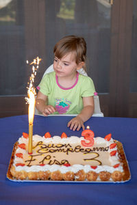 Girl holding ice cream cake