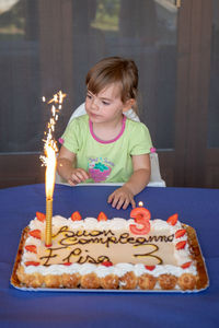 Girl holding ice cream cake