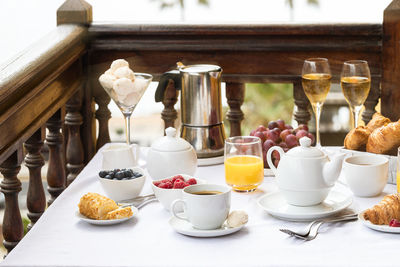 Coffee cup and food on table