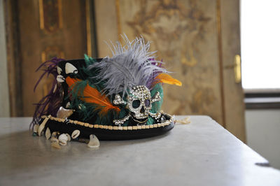 Close-up of parrot on table at home