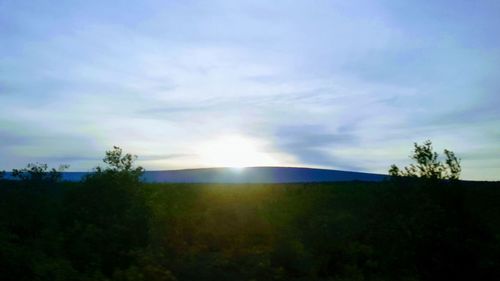 Scenic view of silhouette landscape against sky during sunset