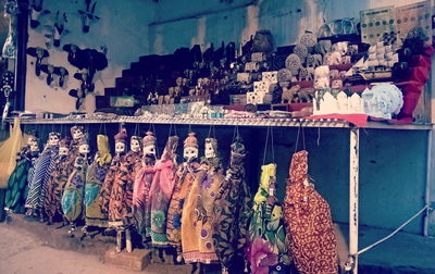 Panoramic view of graffiti on market stall in city