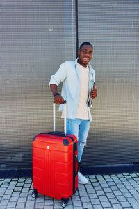 Full length of young man standing on floor