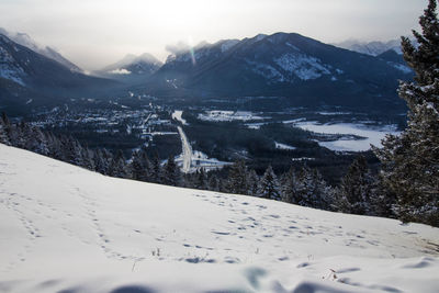 Scenic view of snow covered mountains against sky