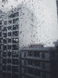 Full frame shot of wet glass window in rainy season