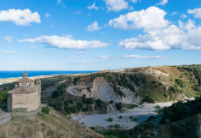 Panoramic view of sea and rocks against sky