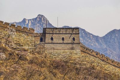 View of castle against mountain range