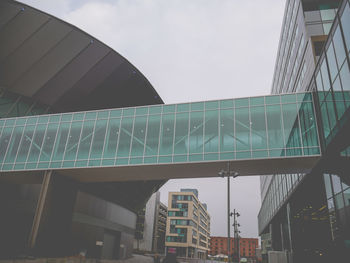 Low angle view of modern building against sky in city