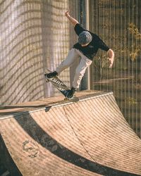 Shadow of man skateboarding on skateboard