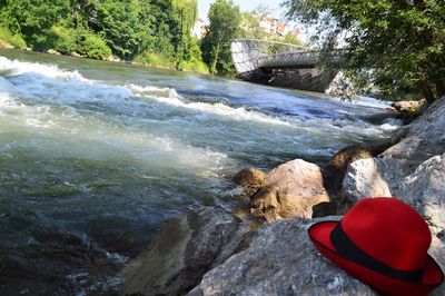 View of river flowing through rocks