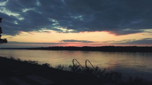 Scenic view of lake at sunset