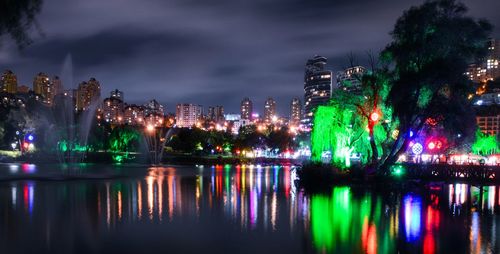 Reflection of illuminated buildings in water at night