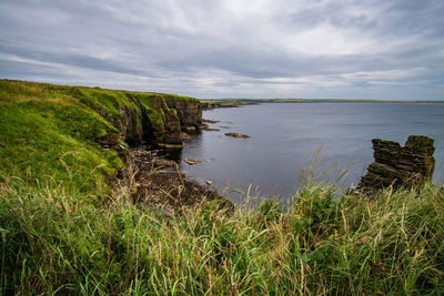 Scenic view of land against sky