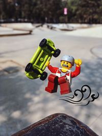 Close-up of toy car on street