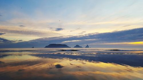 Scenic view of sea against sky at sunset