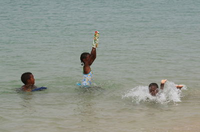 Men playing in sea