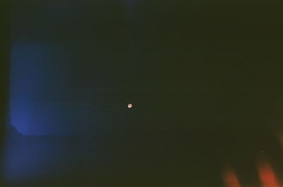 Low angle view of moon in sky at night