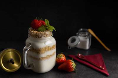 Close-up of fruits in jar on table