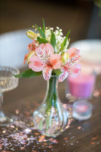 Close-up of pink flower vase on table