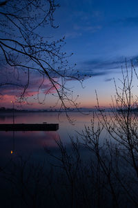 Scenic view of lake against sky at sunset