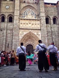 Rear view of people in front of church
