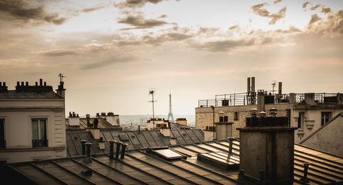 Buildings against sky during sunset