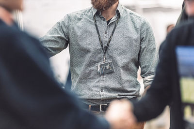 Midsection of man standing outdoors