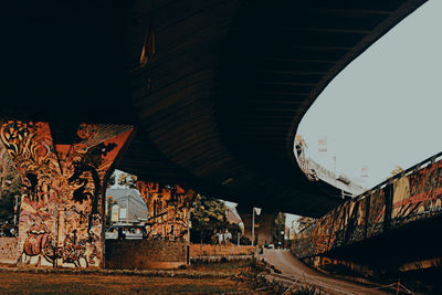 Bridge over old buildings against sky