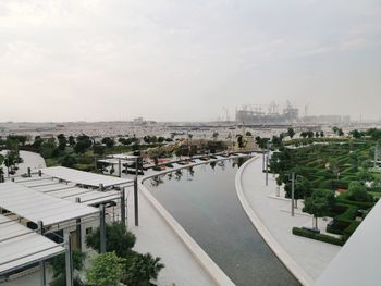 High angle view of buildings against cloudy sky